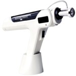 A salon professional using an RF microneedling skin gun to perform a skin rejuvenation treatment.